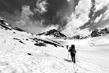 Image showing Two hikers in snow plateau