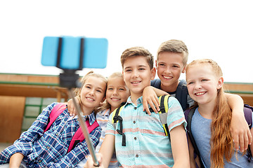 Image showing happy elementary school students taking selfie