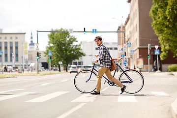 Image showing young man with fixed gear bicycle on crosswalk