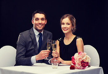 Image showing couple with glasses of champagne at restaurant