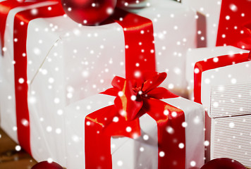 Image showing close up of gift boxes and red christmas balls