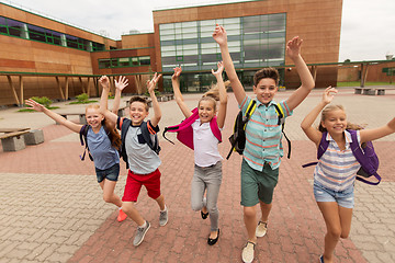 Image showing group of happy elementary school students running