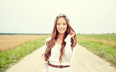 Image showing smiling young hippie woman on cereal field