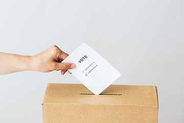 Image showing man putting his vote into ballot box on election