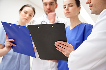 Image showing close up of doctors with clipboard at hospital