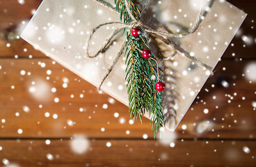 Image showing close up of christmas gift box with fir brunch