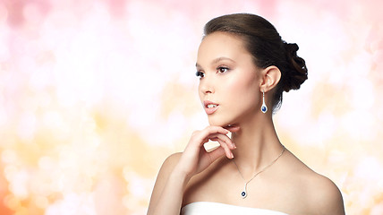 Image showing beautiful asian woman with earring and pendant