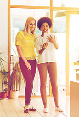 Image showing happy creative team with tablet pc in office