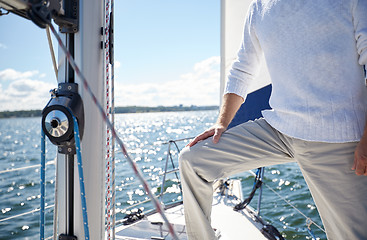 Image showing close up of senior man on yacht sailing in sea