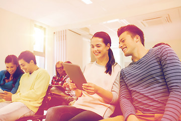 Image showing group of smiling students with tablet pc