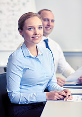 Image showing smiling business people meeting in office