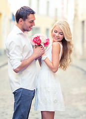 Image showing couple with flowers in the city