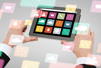 Image showing close up of hands holding tablet pc with app icons