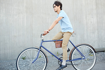 Image showing young hipster man riding fixed gear bike