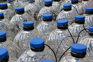 Image showing  row Plastic bottles