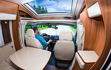 Image showing Man driving on a road in the Camper Van