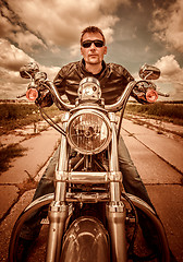 Image showing Biker on a motorcycle