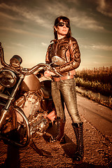 Image showing Biker girl and motorcycle