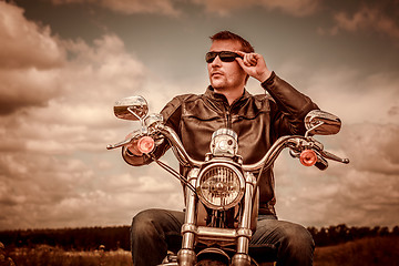 Image showing Biker on a motorcycle