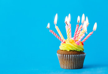 Image showing birthday cupcake with many burning candles