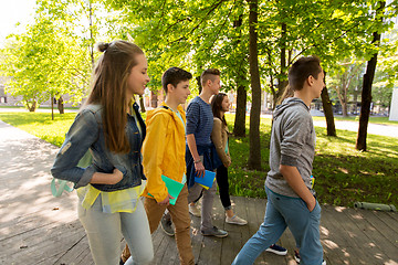 Image showing group of happy teenage students walking outdoors