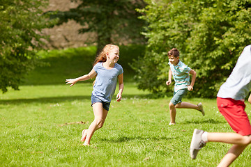 Image showing happy kids running and playing game outdoors