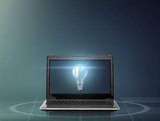 Image showing laptop computer with light bulb on screen