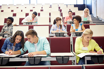 Image showing group of students with notebooks at lecture hall