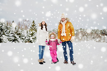 Image showing happy family with child in winter clothes outdoors