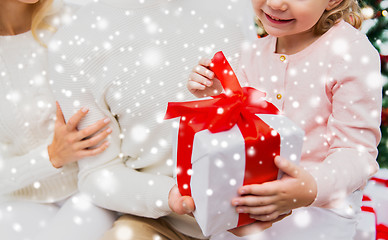 Image showing close up of mother and child girl with gift box