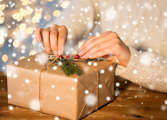 Image showing close up of woman with christmas gift or parcel