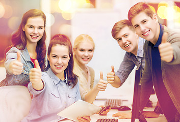 Image showing students with computer monitor and tablet pc