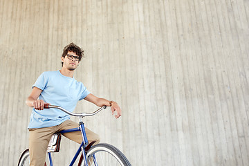 Image showing young hipster man riding fixed gear bike