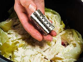 Image showing Chef preparing a traditional norwegian dish, lamb and cabbage wi
