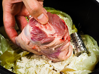 Image showing Chef preparing a traditional norwegian dish, lamb and cabbage wi