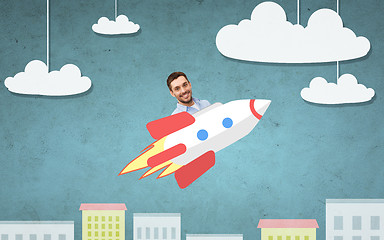 Image showing businessman flying on rocket above cartoon city