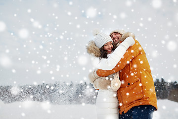 Image showing happy couple hugging and laughing in winter