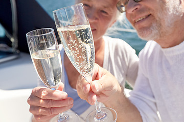 Image showing close up of senior couple with champagne on boat