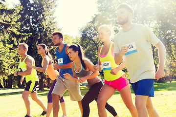 Image showing sportsmen with badge numbers on start of race