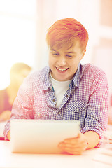 Image showing smiling teenage student with tablet pc computer