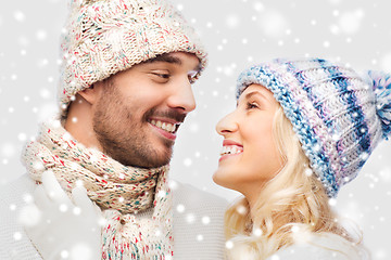 Image showing smiling couple in winter clothes hugging