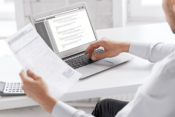 Image showing businessman with laptop computer working at office