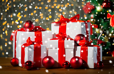 Image showing gift boxes and red balls under christmas tree