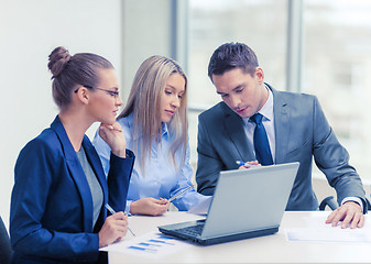 Image showing business team with laptop having discussion