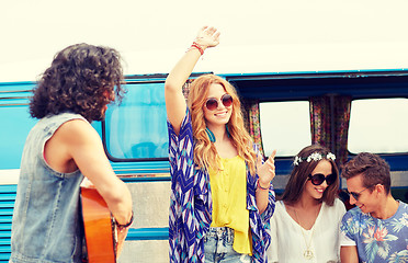 Image showing happy hippie friends having fun over minivan car