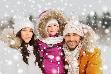 Image showing happy family with child in winter clothes outdoors