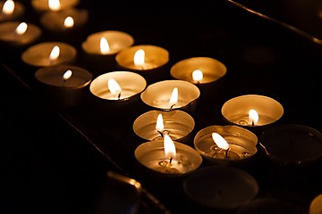 Image showing Candles in a dark church