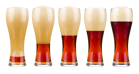 Image showing Five glasses of red beer.