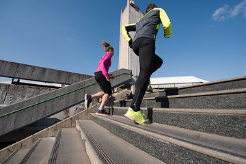 Image showing young  couple jogging on steps