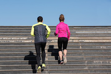 Image showing young  couple jogging on steps
